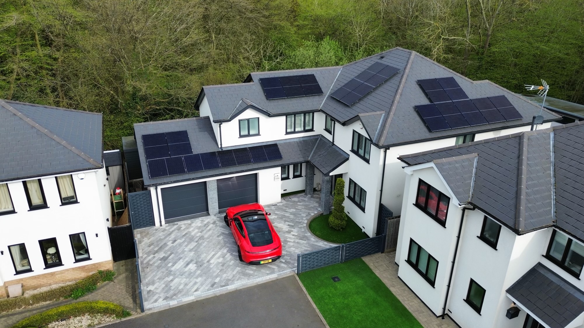 Aerial view of modern solar panels on UK residential roof